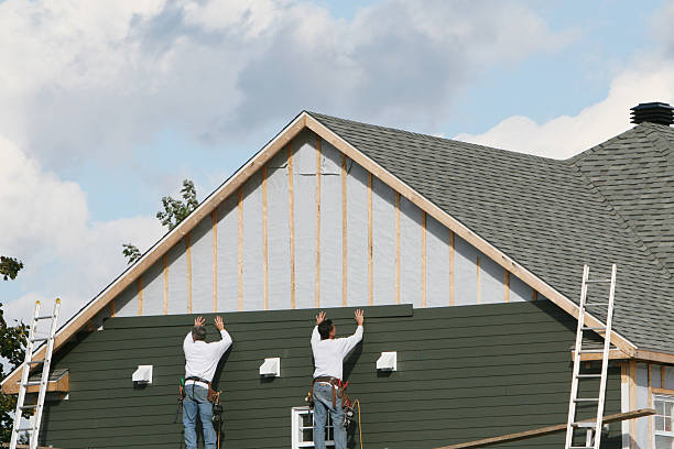 Professional Siding Installation technician working in Reston, VA